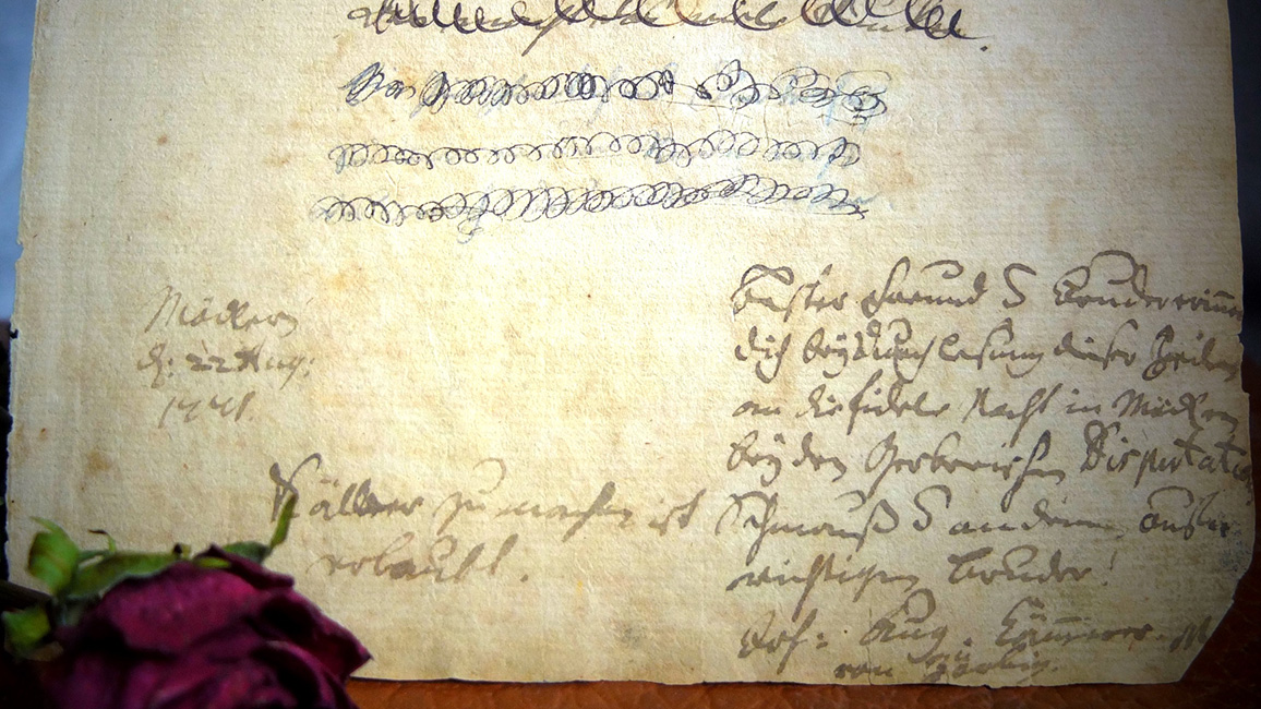 ausgerissene Buchseite mit handschriftlicher Nachricht von Johann August Kämmerer 